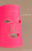 Pink face mask with 'Airyday' branding on a brown background